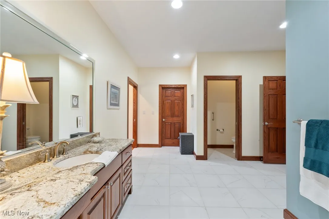Bathroom with vanity and toilet