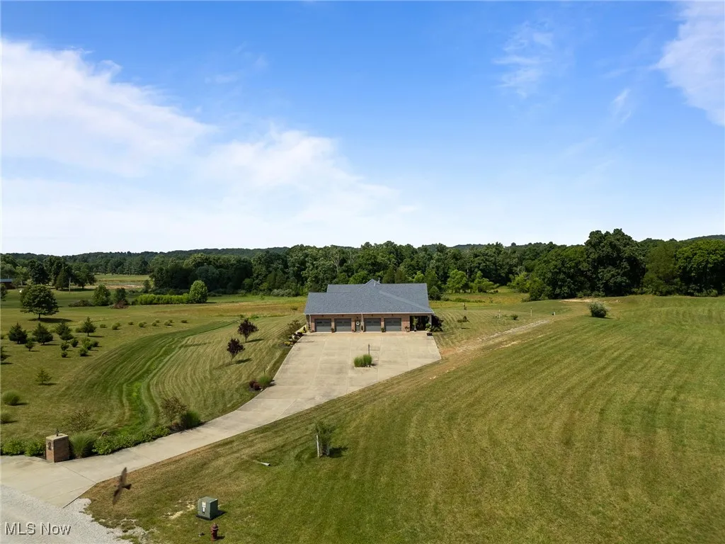 Birds eye view of property featuring a rural view