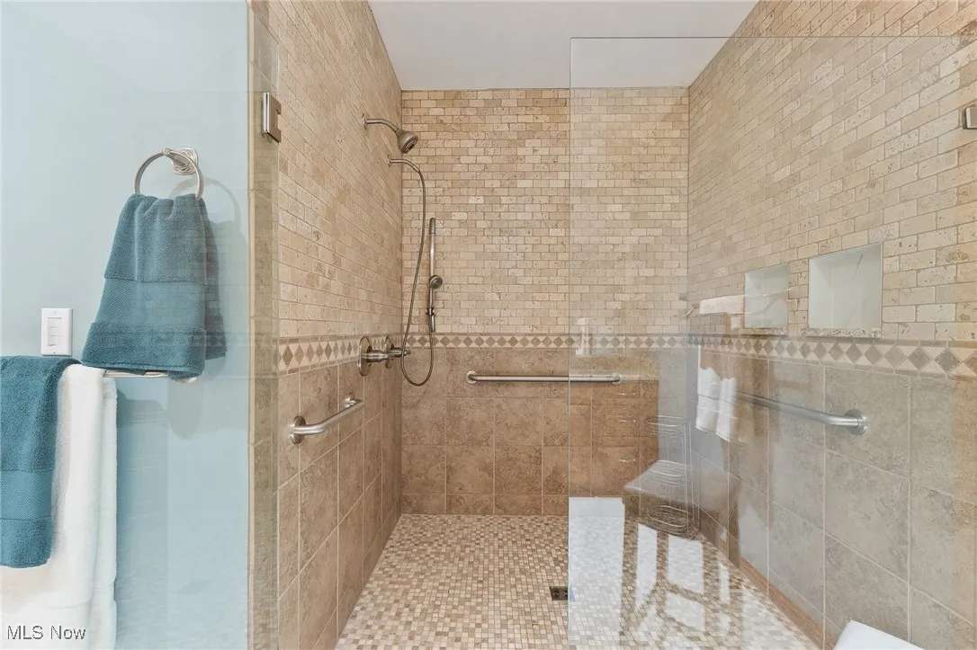 Bathroom featuring a tile shower