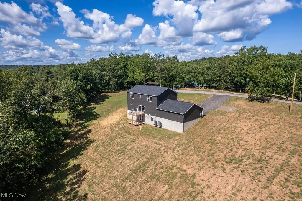 View from above of property with a forest