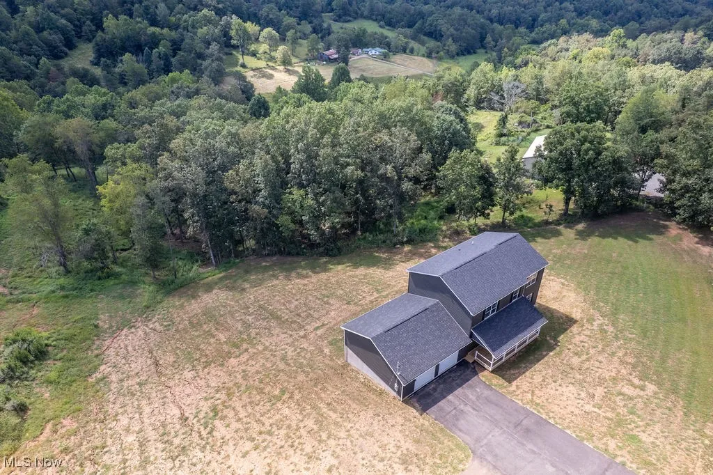 View from above of property with a forest