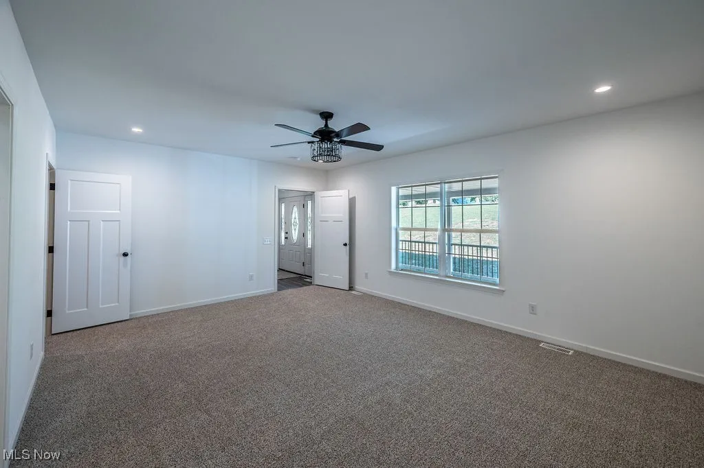 Unfurnished room with recessed lighting, carpet floors, and a ceiling fan