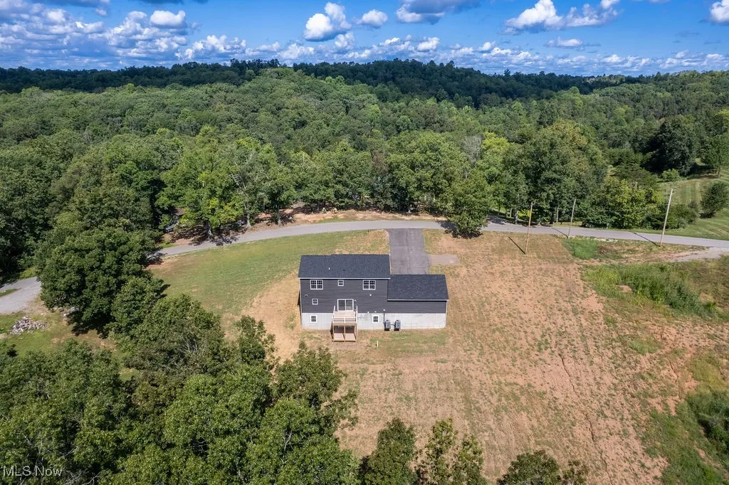 View from above of property featuring a forest