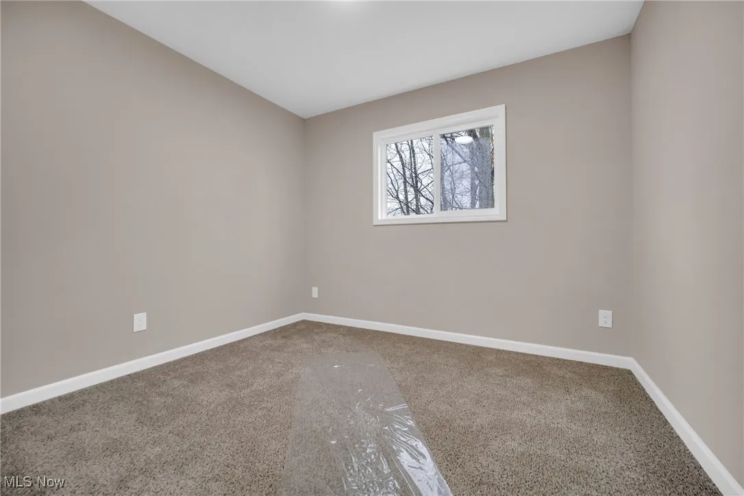 Spare room with carpet floors