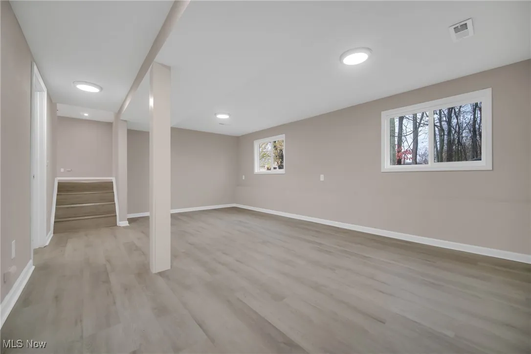 Basement featuring light hardwood / wood-style floors