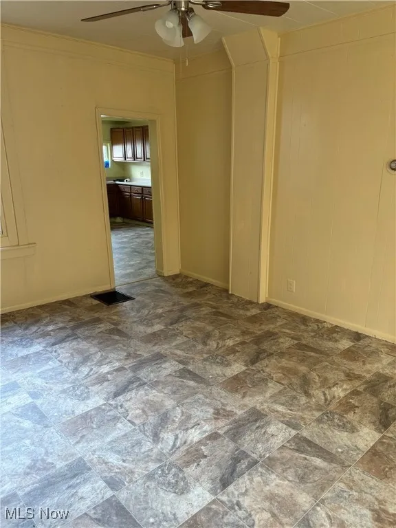 Unfurnished room with ceiling fan
