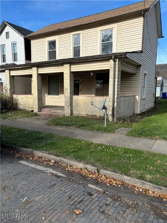 View of front of house with covered porch
