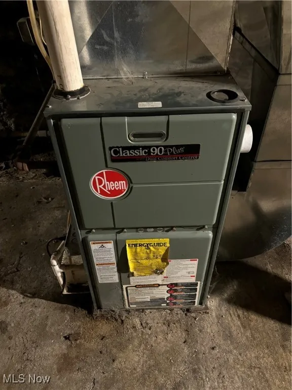 Utility room featuring heating unit