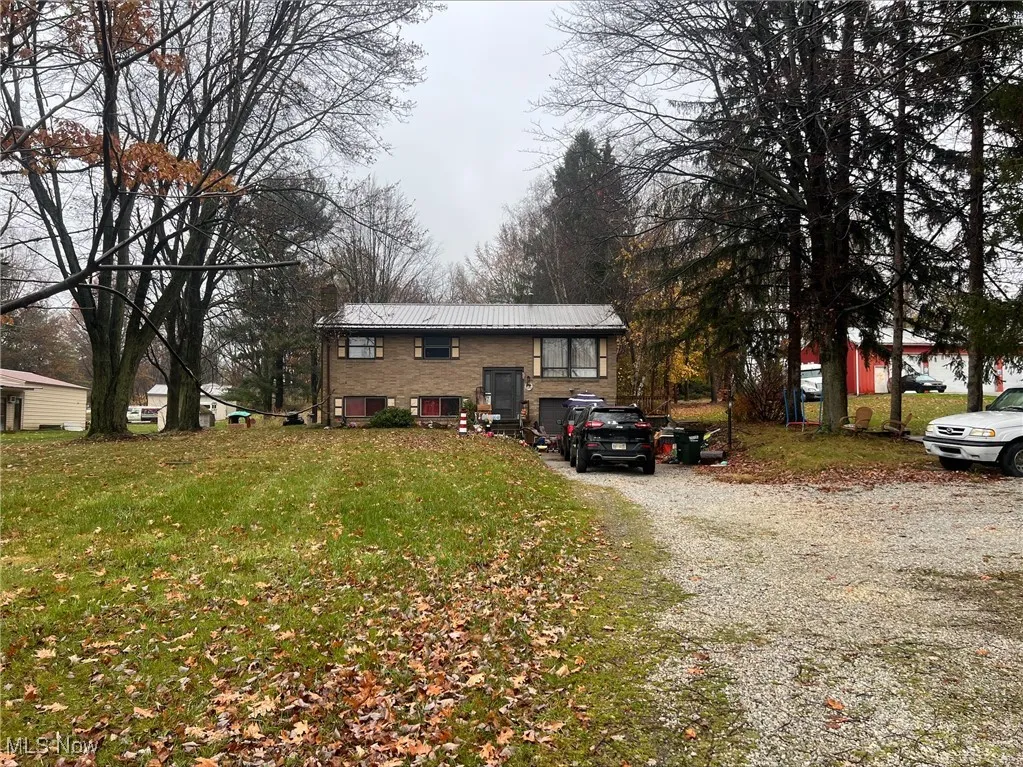 View of front of property featuring a front lawn