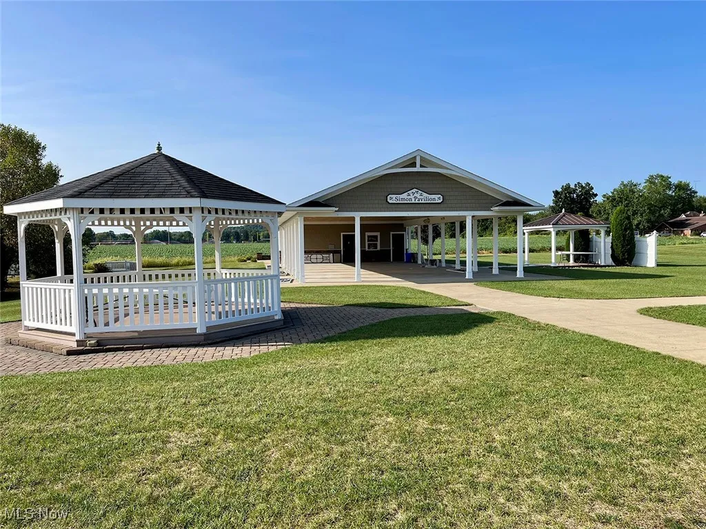 Surrounding community with a gazebo and a lawn