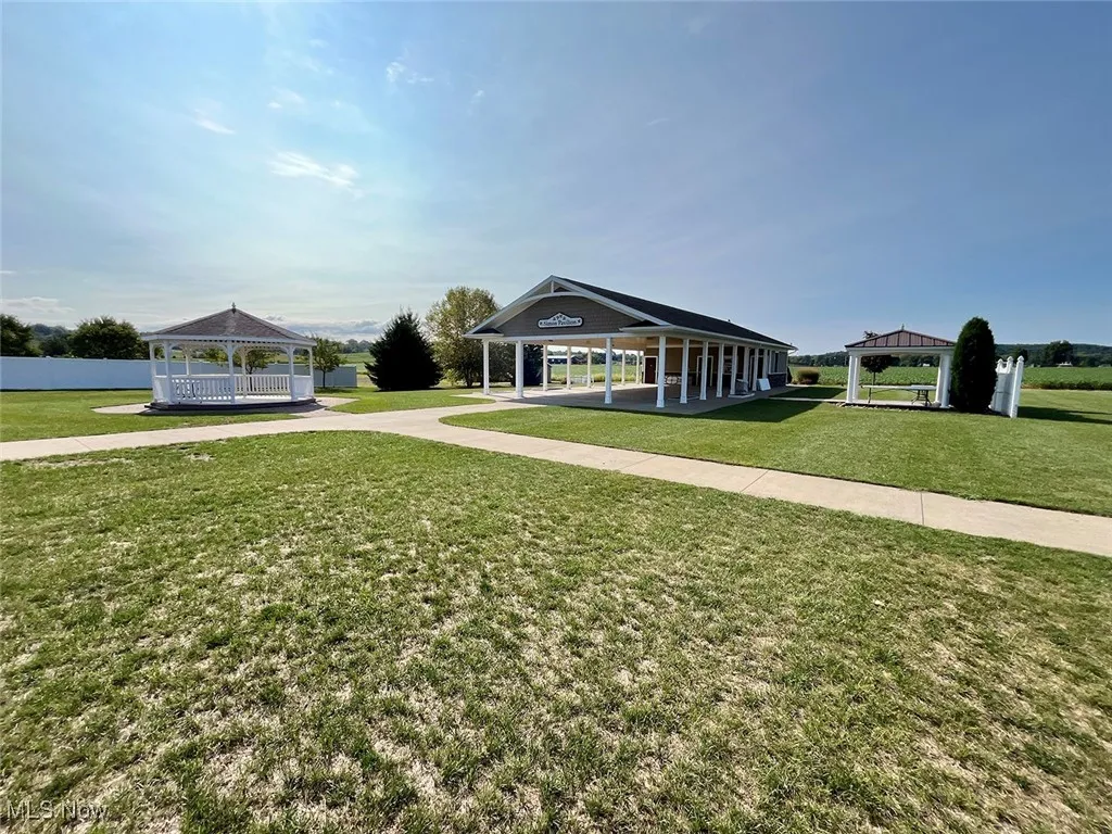 View of front of house with a gazebo and a front lawn