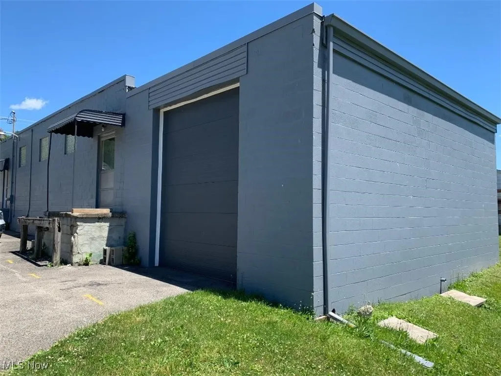 View of property exterior with a garage