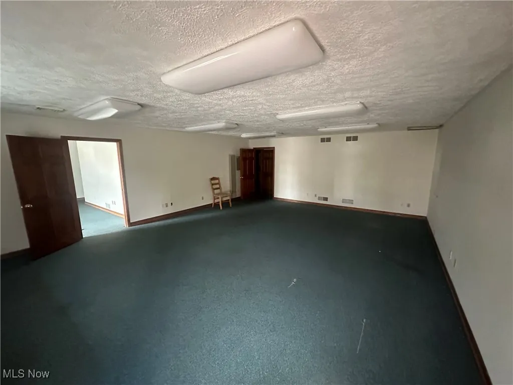 Spare room with a textured ceiling
