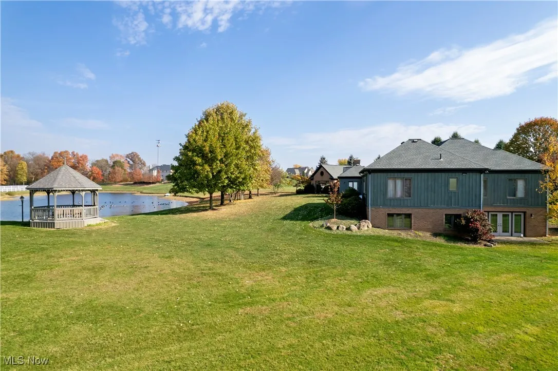 View of yard featuring a gazebo and a water view