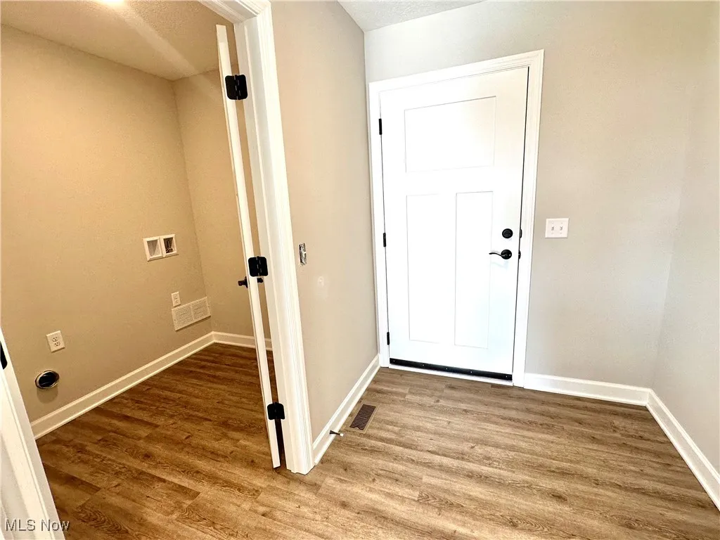 Entryway featuring wood-type flooring