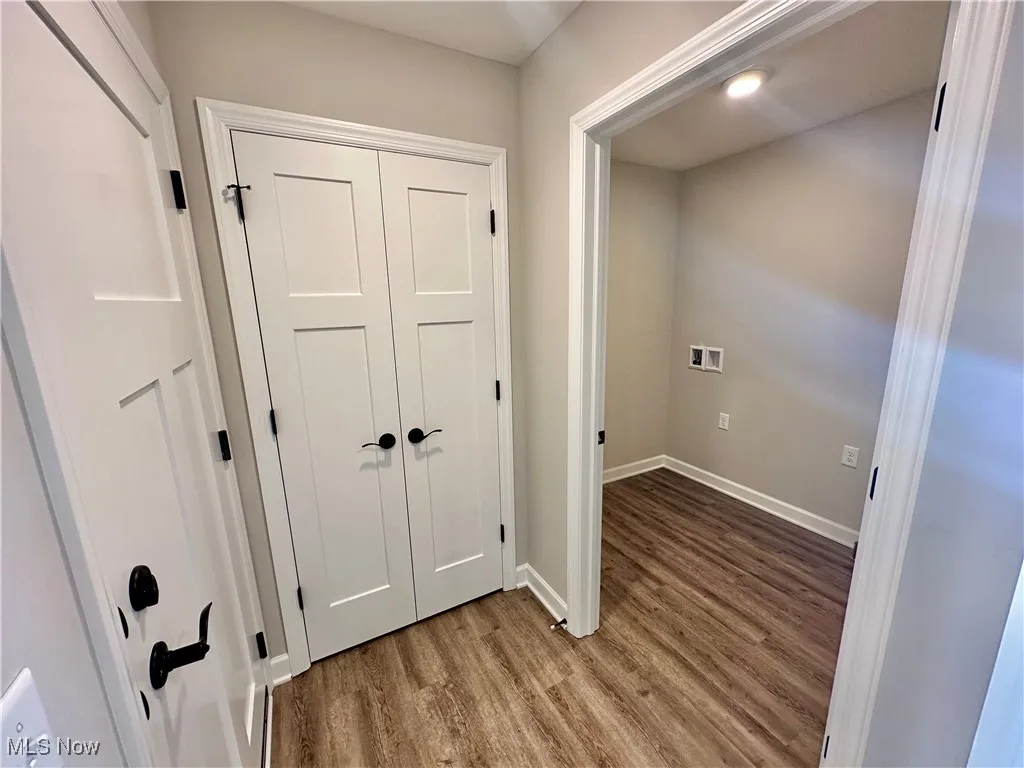 Hallway with wood-type flooring