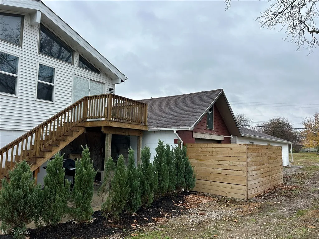 View of home's exterior featuring a wooden deck
