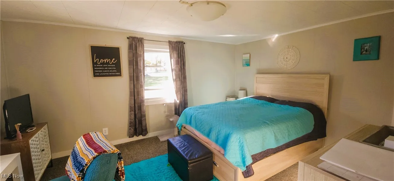 1st floor bedroom located conveniently to laundry and kitchen.