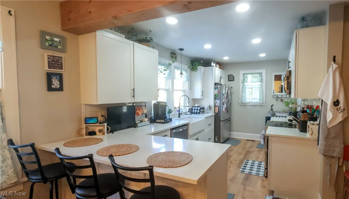 Kitchen with breakfast bar for casual dining and snacks.