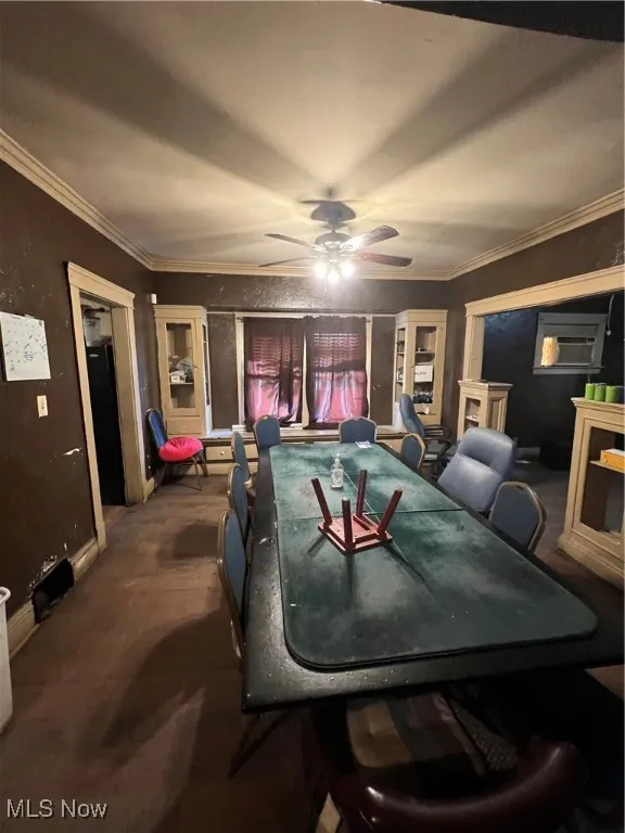 Recreation room featuring ceiling fan and crown molding