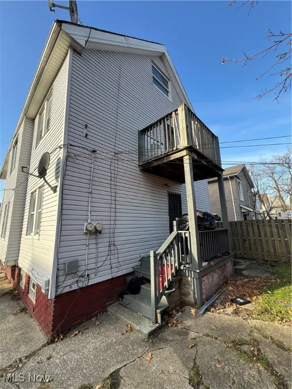 Rear view of property featuring a balcony