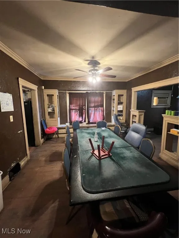 Playroom featuring ceiling fan and crown molding