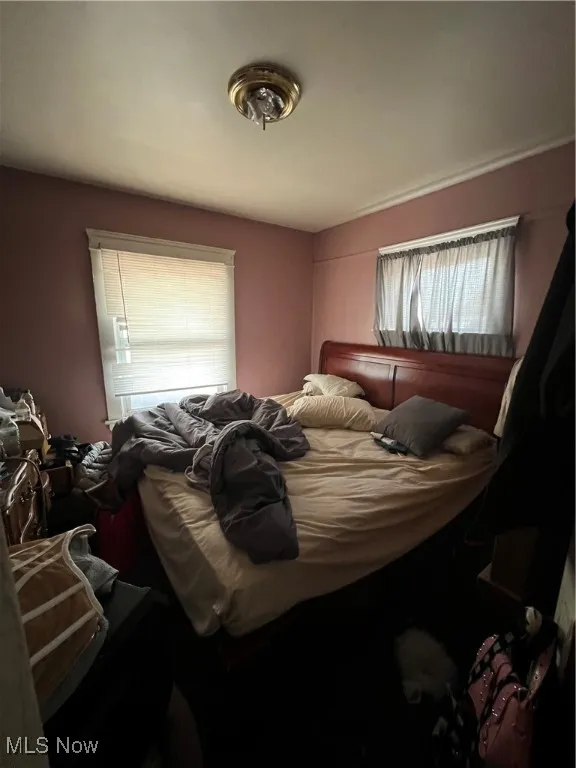 Bedroom with multiple windows