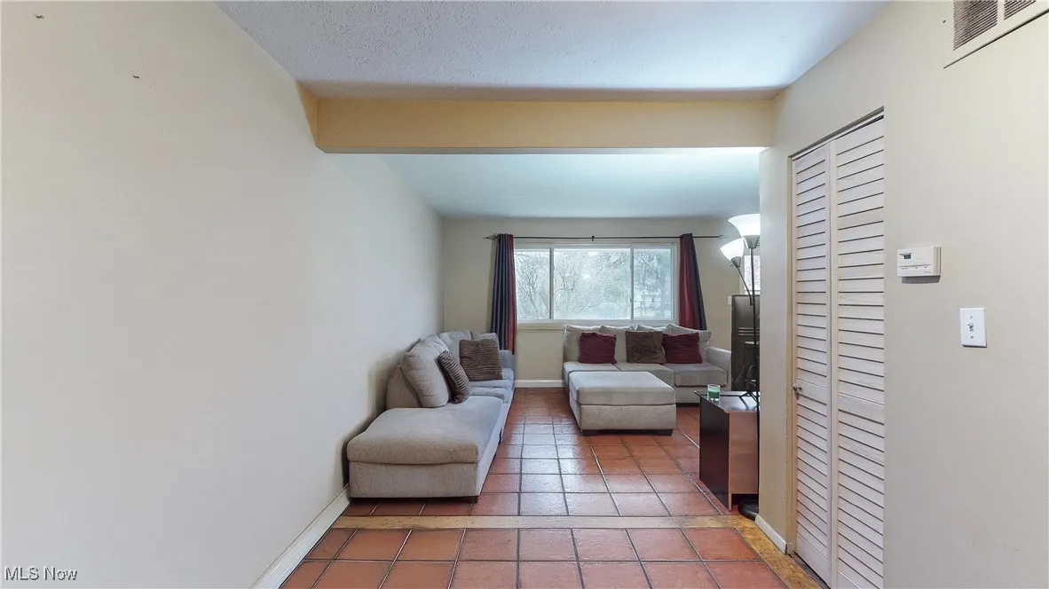 Living room featuring tile patterned flooring