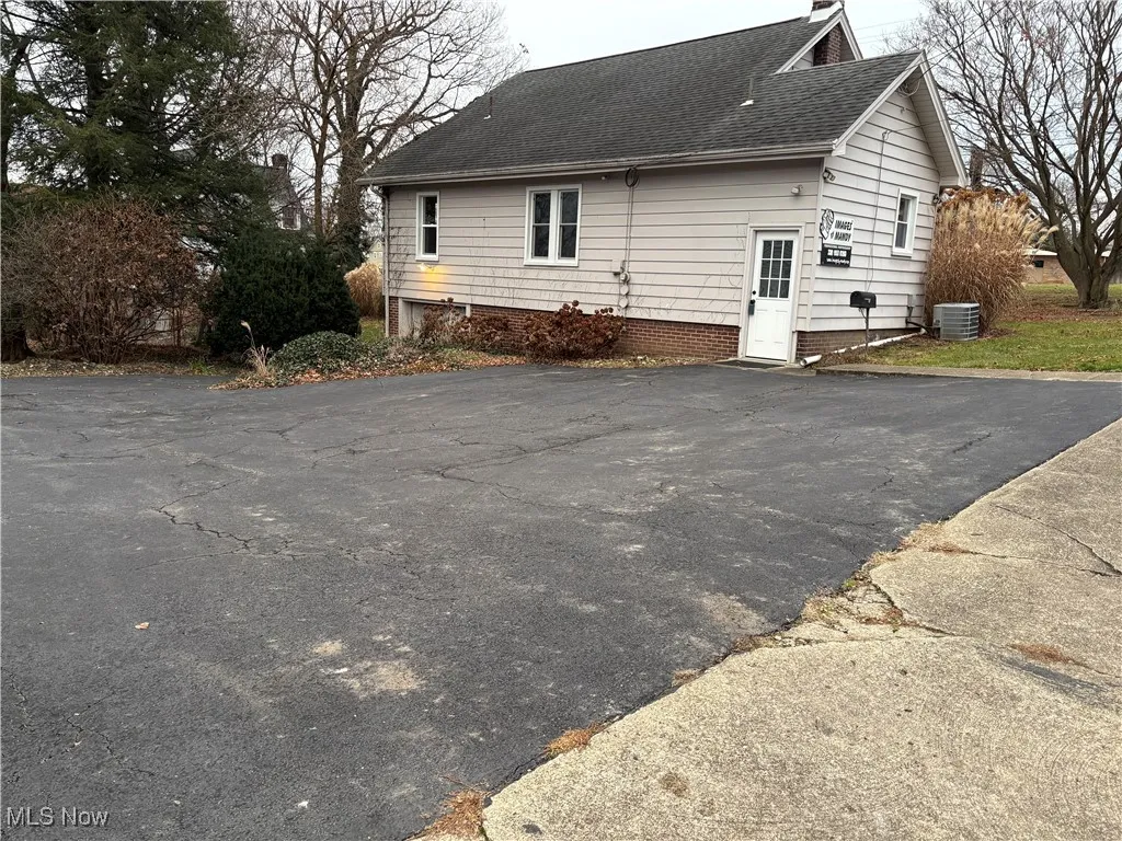 Back of property paved parking out with ample parking space,