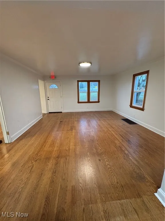 Large Room featuring hardwood flooring