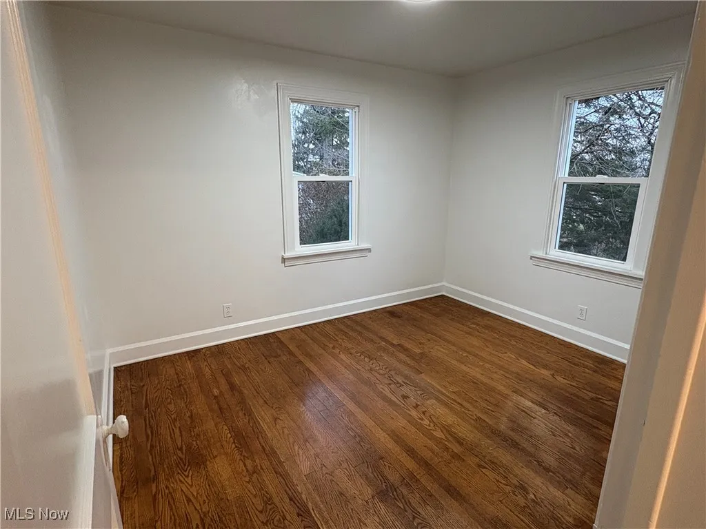 Room with dark hardwood flooring