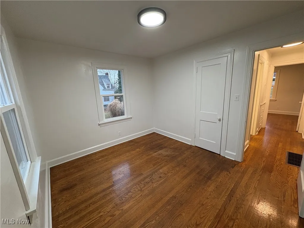 Room with dark hardwood flooring