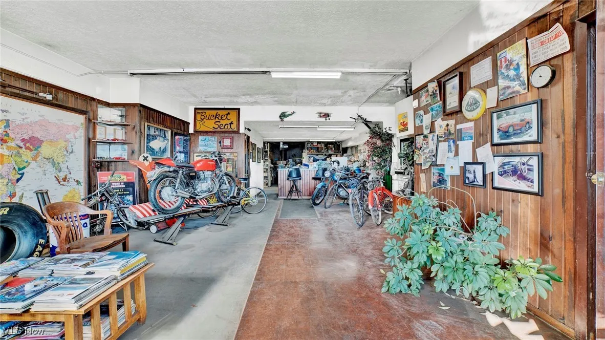 Garage featuring wooden walls