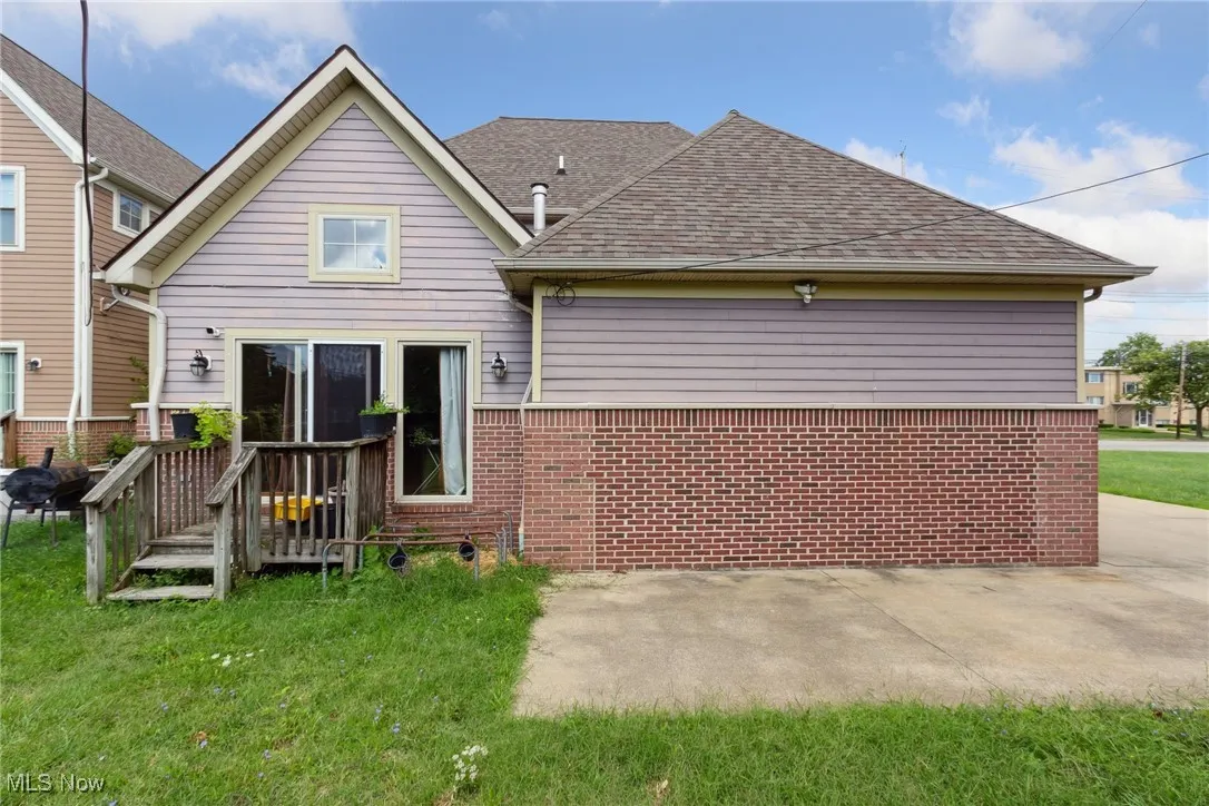 Rear view of property featuring a lawn
