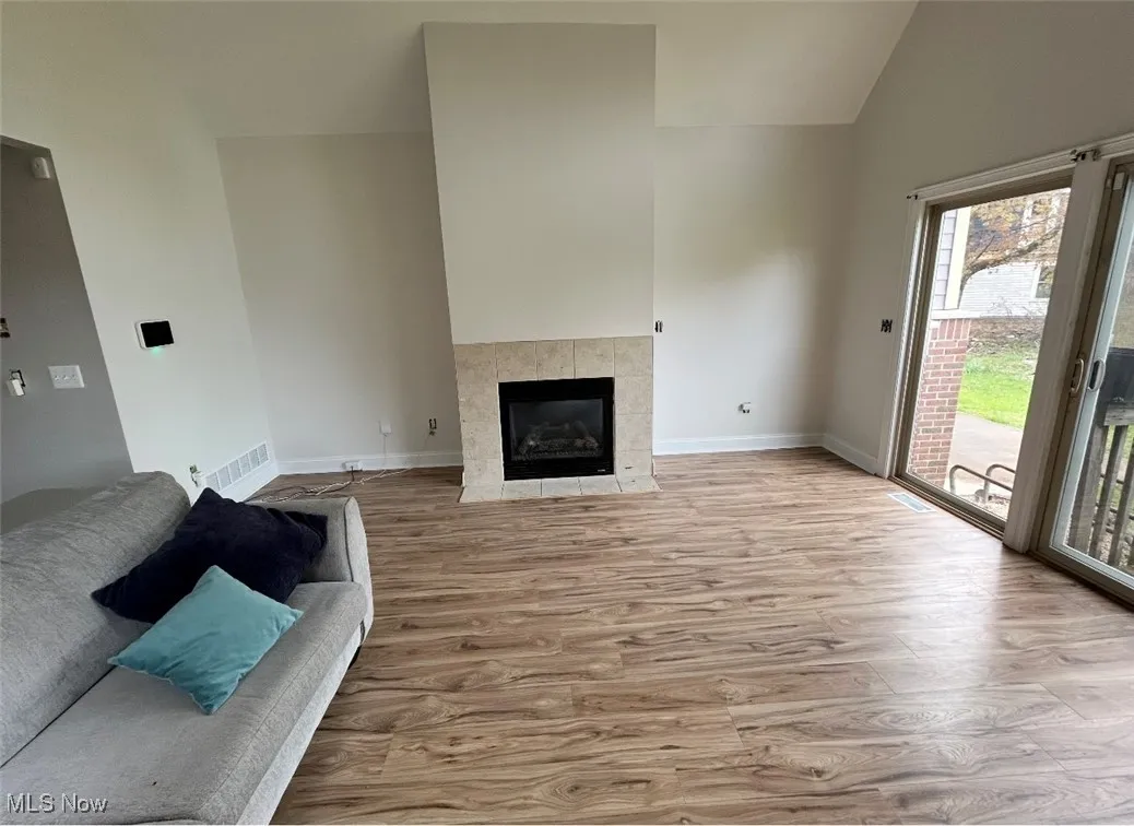 Wood finished floors, a wealth of natural light, and a fireplace