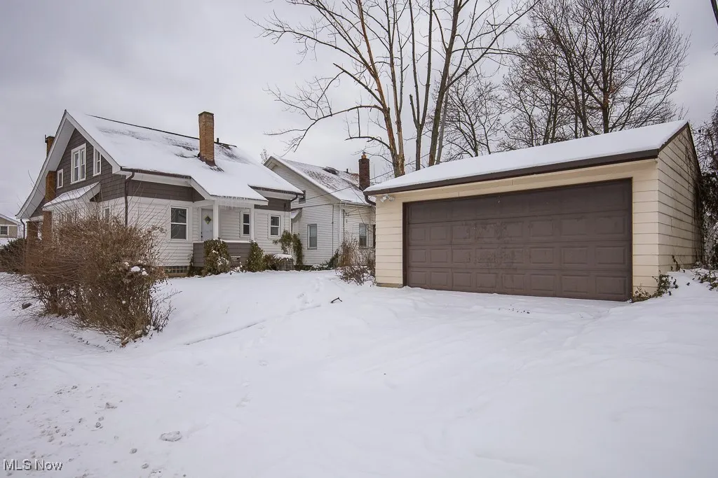 View of front of property featuring a garage