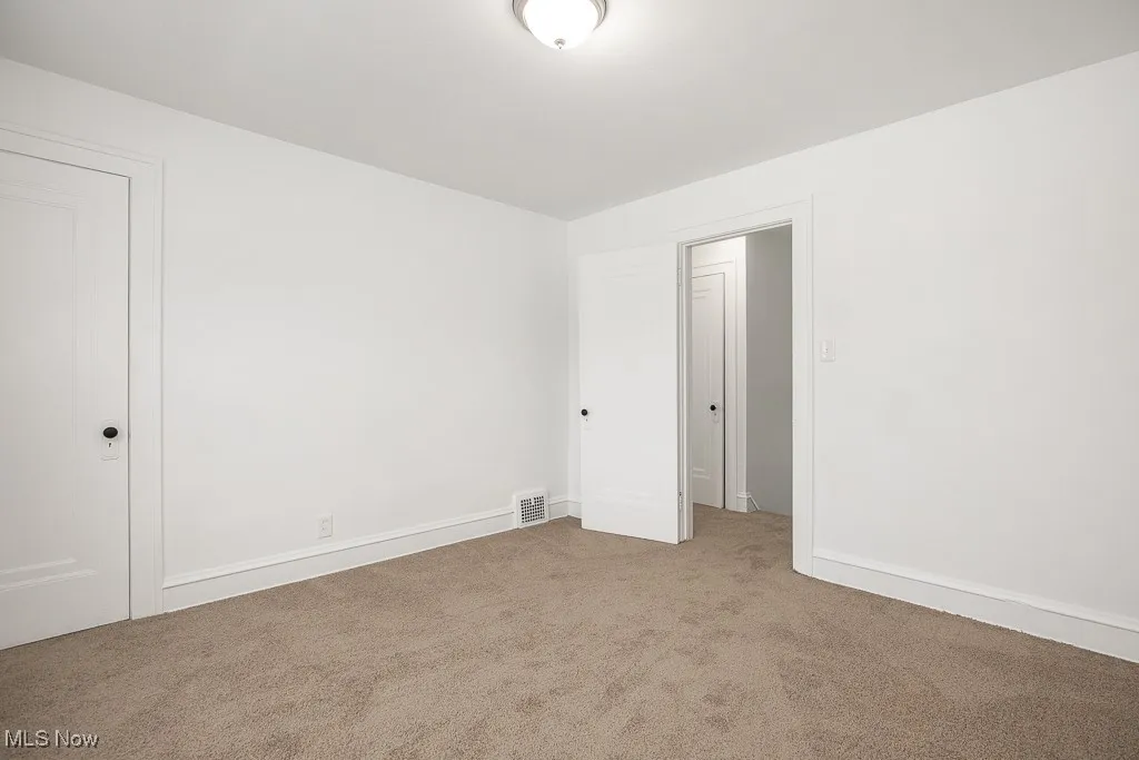 Spare room featuring carpet floors