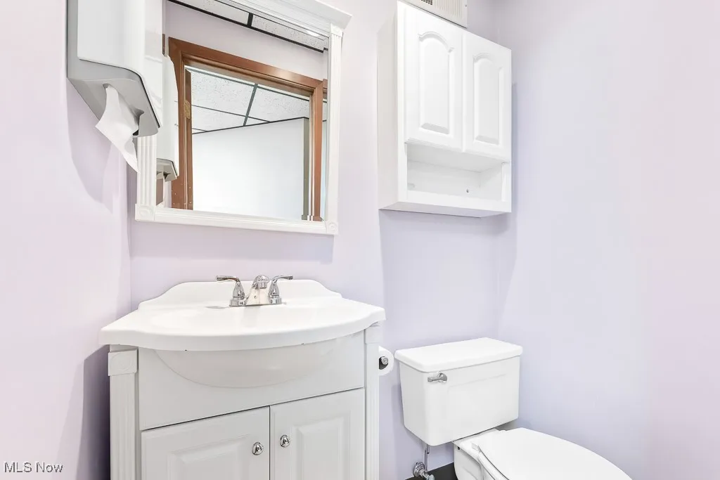 Bathroom with toilet and vanity