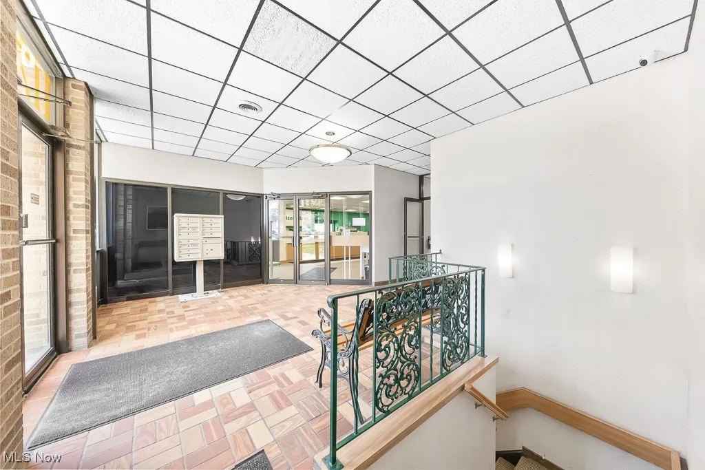Hall with an upstairs landing and visible vents