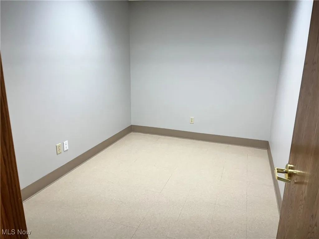 Empty room featuring baseboards
