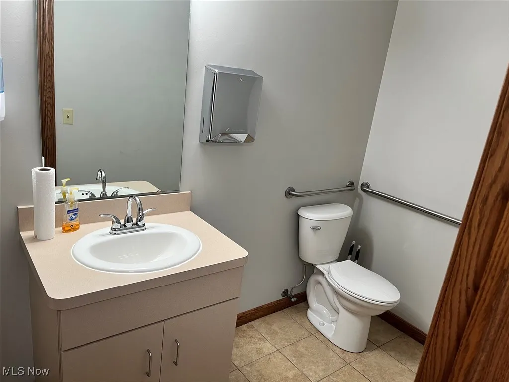 Bathroom with vanity and tile patterned floors