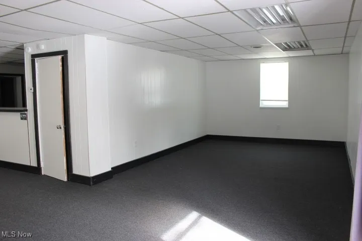 Unfurnished room featuring a paneled ceiling