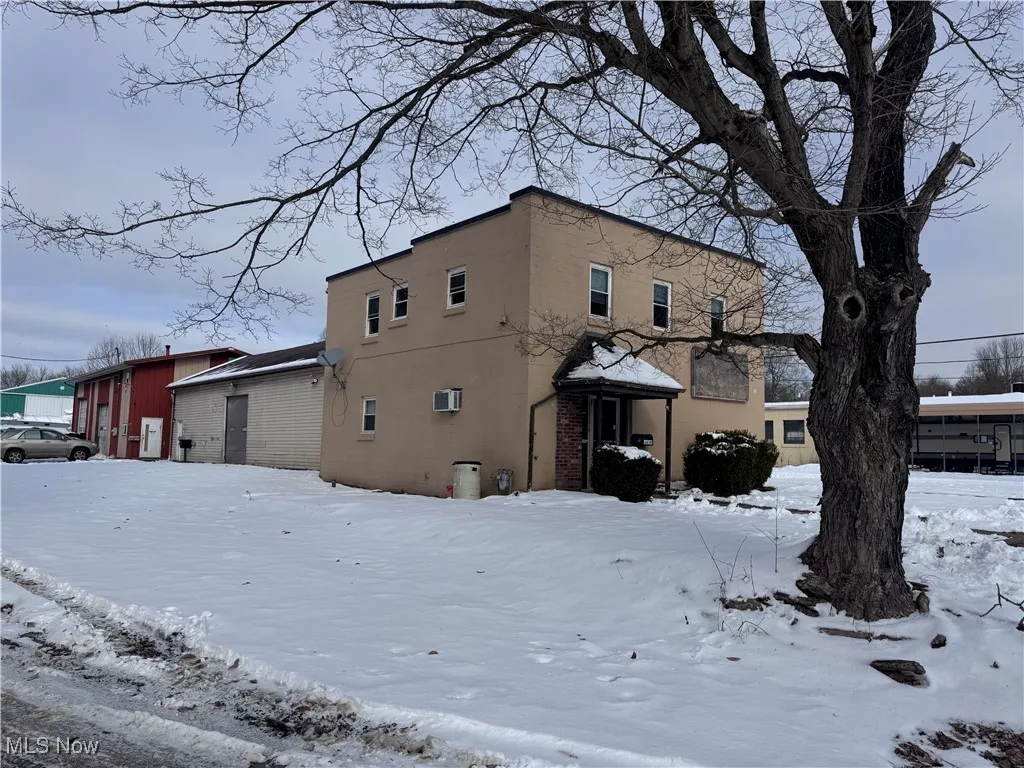 View of snow covered property