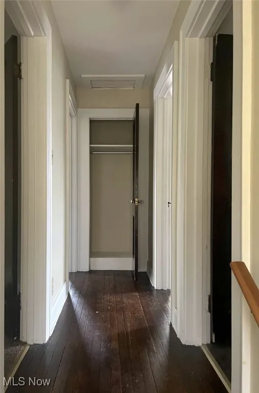 Corridor with dark wood-type flooring