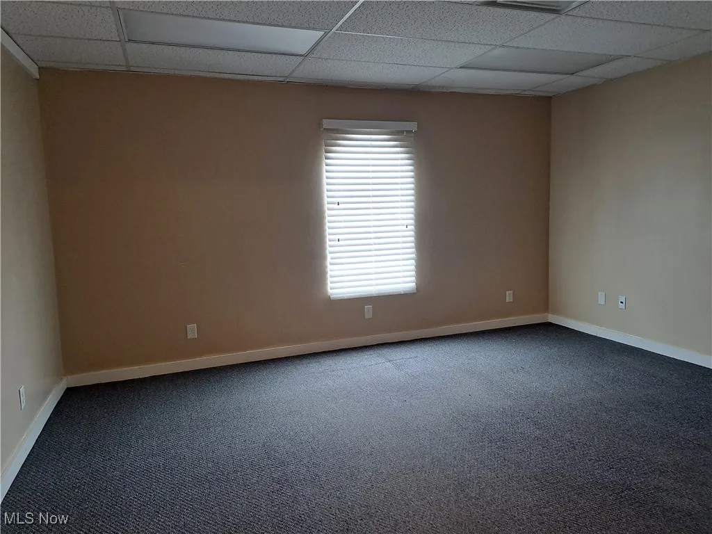 Office with carpeted floor