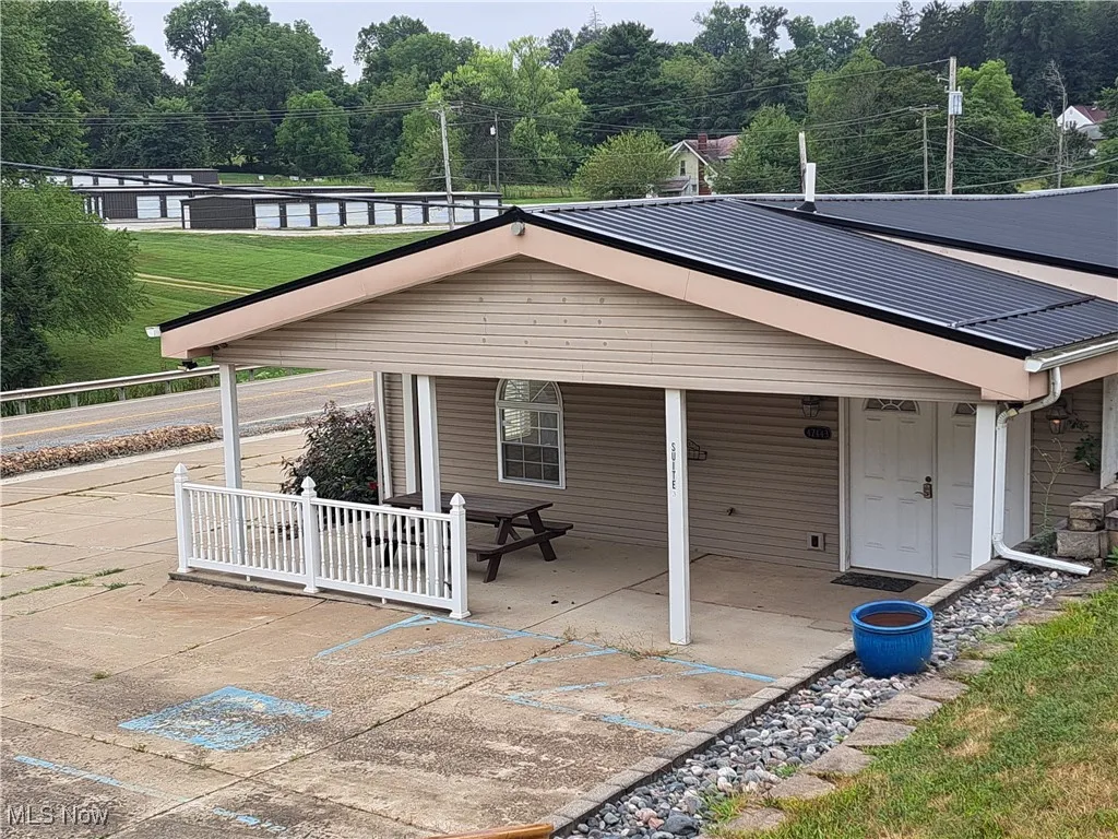  Front entrance with covered porch and a metal roof