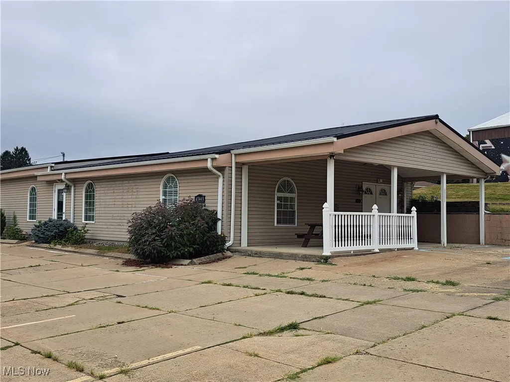View of front of building with covered porch
