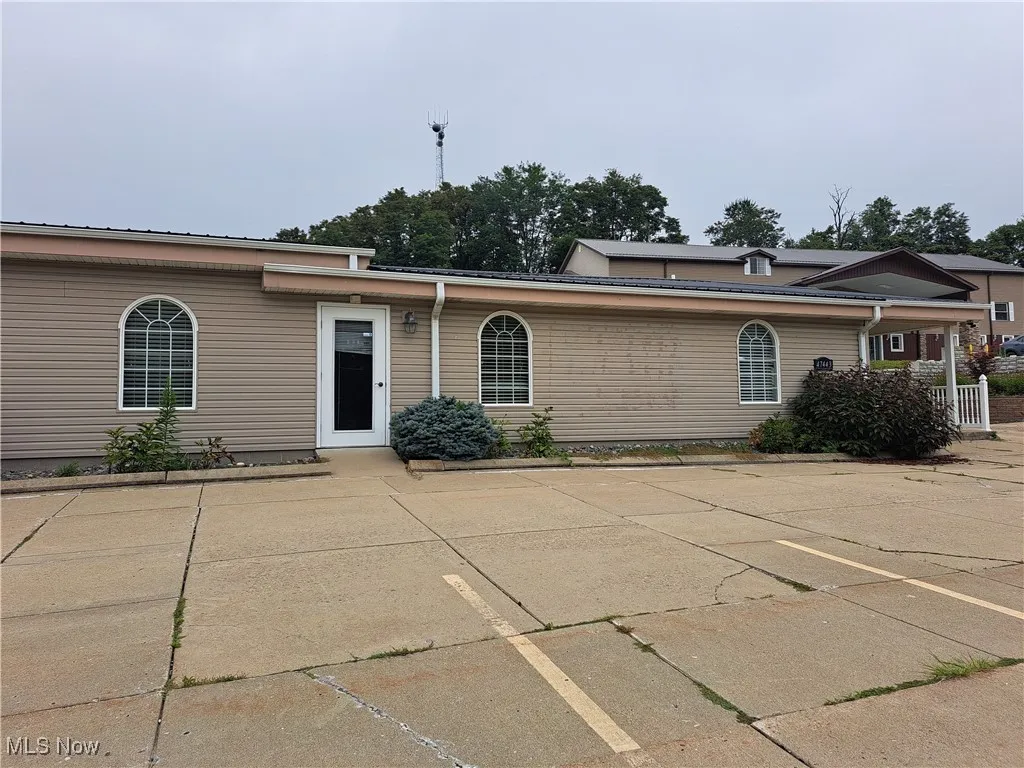Side of building with private office door