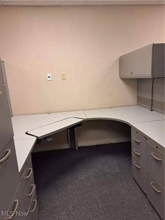 Cubicle with locking office desk, filing cabinets, wardrobe, shelving