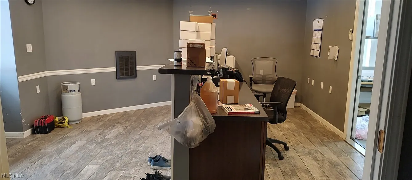 Office space featuring wood-type flooring